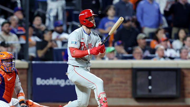 Oct 8, 2024; New York City, New York, USA; Philadelphia Phillies first baseman Bryce Harper (3) hits an RBI single in the eighth inning against the New York Mets during game three of the NLDS for the 2024 MLB Playoffs at Citi Field. Mandatory Credit: Brad Penner-Imagn Images Oct 8, 2024; New York City, New York, USA; Philadelphia Phillies first baseman Bryce Harper (3) hits an RBI single in the eighth inning against the New York Mets during game three of the NLDS for the 2024 MLB Playoffs at Citi Field. Mandatory Credit: Brad Penner-Imagn Images