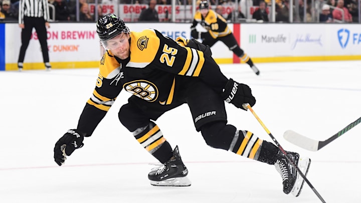 Oct 24, 2024; Boston, Massachusetts, USA;  Boston Bruins defenseman Brandon Carlo (25) tries to block a shot during the second period against the Dallas Stars at TD Garden. Mandatory Credit: Bob DeChiara-Imagn Images
