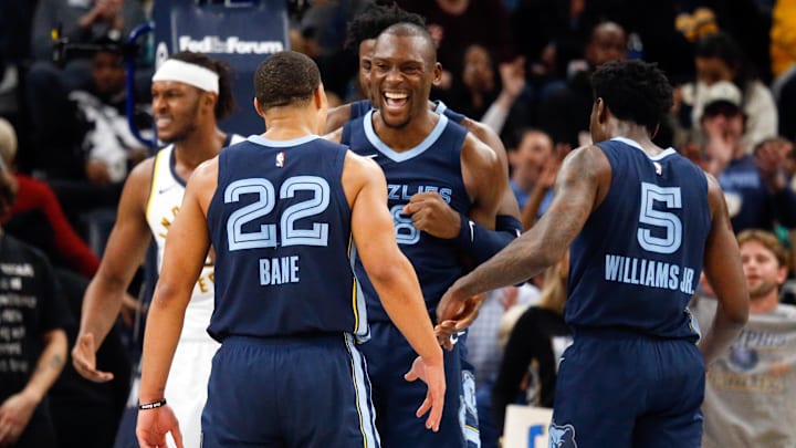 Memphis Grizzlies guard Desmond Bane (22), forward-center Jaren Jackson Jr. (13) and guard Vince Williams Jr. (5) react with center Bismack Biyombo (18) after a dunk during the second half against the Indiana Pacers at FedExForum. Mandatory Credit: Petre Thomas-Imagn Images