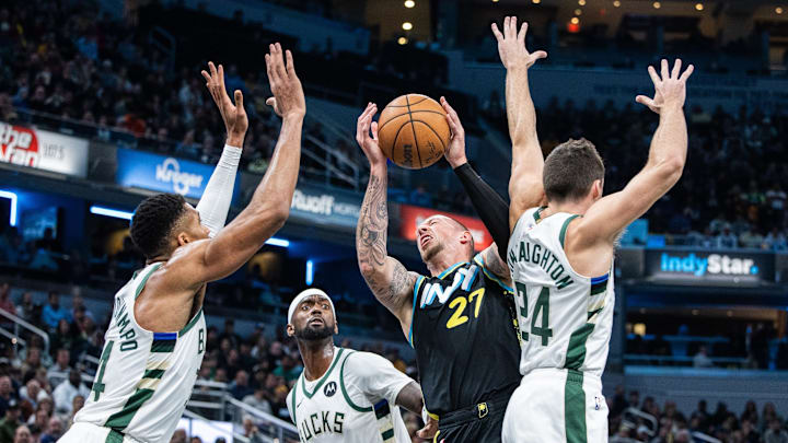 Nov 9, 2023; Indianapolis, Indiana, USA; Indiana Pacers center Daniel Theis (27) shoots the ball while the Milwaukee Bucks defend in the second half at Gainbridge Fieldhouse. Mandatory Credit: Trevor Ruszkowski-Imagn Images