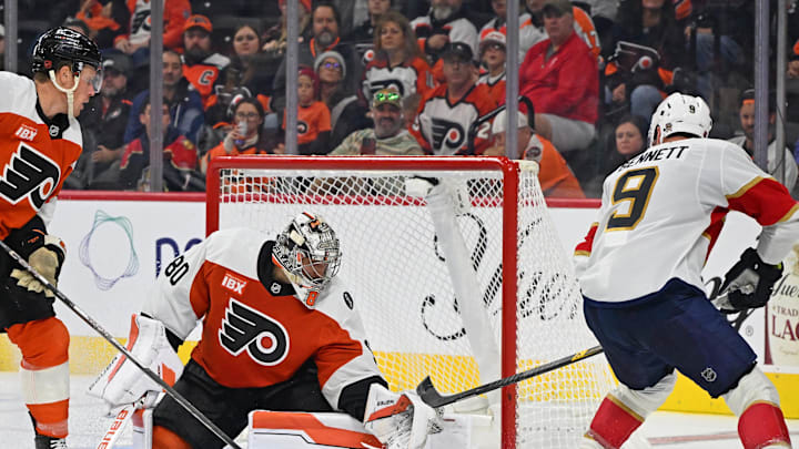 Oct 13, 2025; Philadelphia, Pennsylvania, USA; Philadelphia Flyers goaltender Dan Vladar (80) makes a save against Florida Panthers center Sam Bennett (9) during the third period at Wells Fargo Center. Mandatory Credit: Eric Hartline-Imagn Images