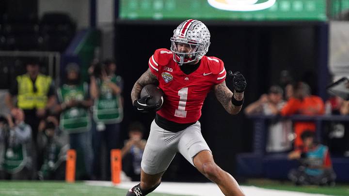 Dec 31, 2025; Arlington, TX, USA; Ohio State Buckeyes wide receiver Brandon Inniss (1) runs with the ball in the fourth quarter against the Miami Hurricanes during the 2025 Cotton Bowl and quarterfinal game of the College Football Playoff at AT&T Stadium. Mandatory Credit: Raymond Carlin III-Imagn Images Dec 31, 2025; Arlington, TX, USA; Ohio State Buckeyes wide receiver Brandon Inniss (1) runs with the ball in the fourth quarter against the Miami Hurricanes during the 2025 Cotton Bowl and quarterfinal game of the College Football Playoff at AT&T Stadium. Mandatory Credit: Raymond Carlin III-Imagn Images