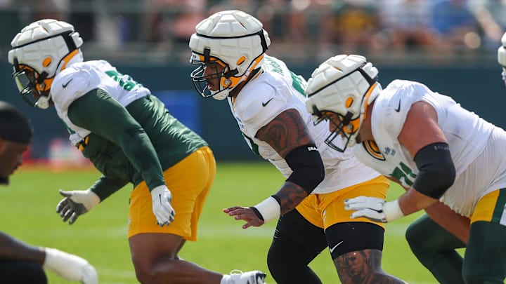 Green Bay Packers offensive linemen through a drill during a practice at training camp. Green Bay Packers offensive linemen through a drill during a practice at training camp.