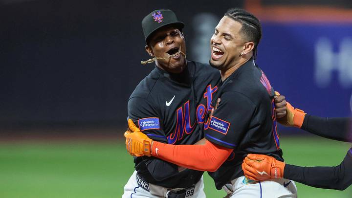 New York Mets designated hitter Christopher Morel celebrates with relief pitcher Jefry Yan.
