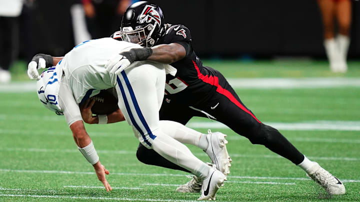 Dec 24, 2023; Atlanta, Georgia, USA; Atlanta Falcons defensive end Zach Harrison (96) takes down Indianapolis Colts quarterback Gardner Minshew (10) during the first half at Mercedes-Benz Stadium. Mandatory Credit: John David Mercer-Imagn Images