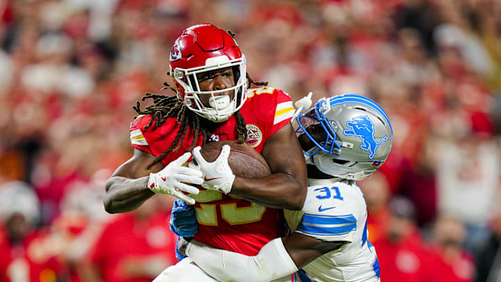Oct 12, 2025; Kansas City, Missouri, USA; Kansas City Chiefs running back Kareem Hunt (29) is tackled by Detroit Lions safety Kerby Joseph (31) during the second half at GEHA Field at Arrowhead Stadium. Mandatory Credit: Jay Biggerstaff-Imagn Images