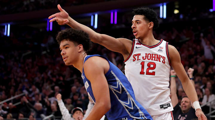 Mar 15, 2025; New York, NY, USA; St. John's Red Storm guard RJ Luis Jr. (12) celebrates his three point shot against Creighton Bluejays forward Jasen Green (0) during the second half at Madison Square Garden. Mandatory Credit: Brad Penner-Imagn Images
