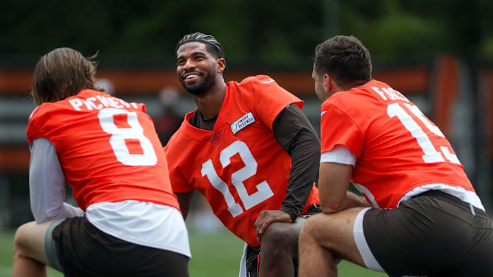 Cleveland Browns quarterback Shedeur Sanders (12) chats with quarterback Kenny Pickett (8) and quarterback Joe Flacco (15) during practice at NFL minicamp, Tuesday, June 10, 2025, in Berea, Ohio. [Jeff Lange/Beacon Journal]