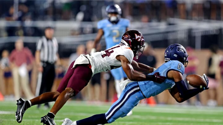 Sep 2, 2022; Norfolk, Virginia, USA;  Old Dominion Monarchs wide receiver Ali Jennings III (0) misses a catch against Virginia Tech Hokies defensive back Dorian Strong (44) during the third quarter at Kornblau Field at S.B. Ballard Stadium. Mandatory Credit: Peter Casey-USA TODAY Sports
