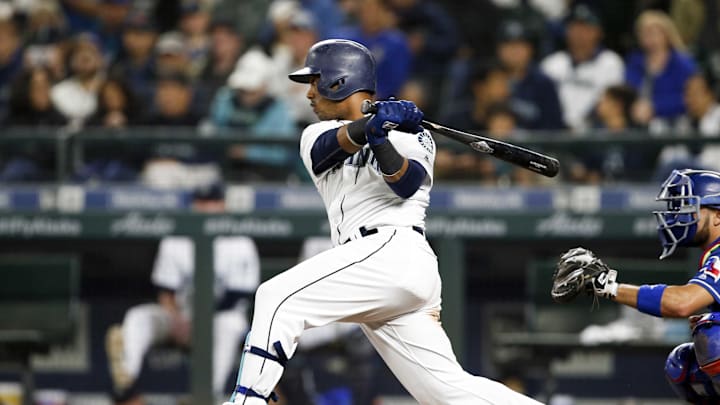 Seattle Mariners shortstop Jean Segura (2) hits an RBI-single against the Texas Rangers during the seventh inning at Safeco Field in 2018.