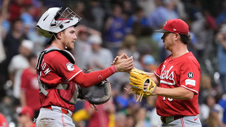 Sep 26, 2025; Milwaukee, Wisconsin, USA;  Cincinnati Reds catcher Tyler Stephenson (37) greets pitcher Emilio Pagan (15) following the game against the Milwaukee Brewers at American Family Field. Mandatory Credit: Jeff Hanisch-Imagn Images