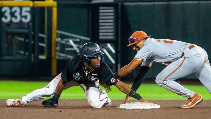 Jun 13, 2026; Omaha, NE, USA; Georgia Bulldogs second baseman Ryan Wynn (0) steals second against Texas Longhorns shortstop Adrian Rodriguez (24) during the seventh inning at Charles Schwab Field. Mandatory Credit: Dylan Widger-Imagn Images Jun 13, 2026; Omaha, NE, USA; Georgia Bulldogs second baseman Ryan Wynn (0) steals second against Texas Longhorns shortstop Adrian Rodriguez (24) during the seventh inning at Charles Schwab Field. Mandatory Credit: Dylan Widger-Imagn Images