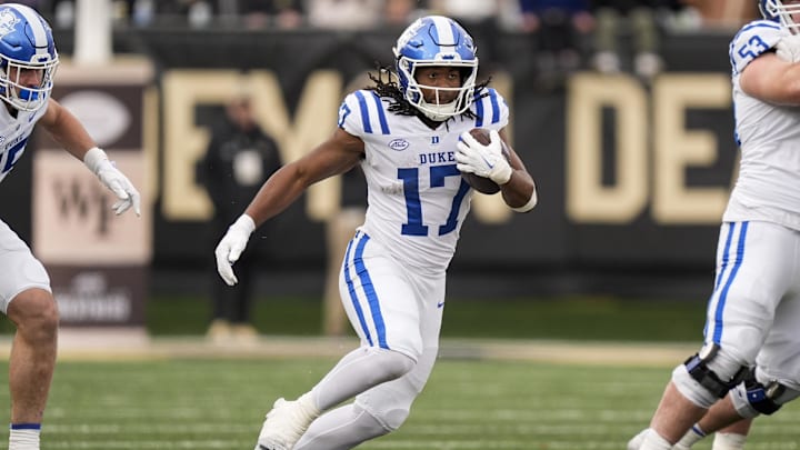 Nov 30, 2024; Winston-Salem, North Carolina, USA; Duke Blue Devils running back Star Thomas (17) runs for yardage against the Wake Forest Demon Deacons during the second half at Allegacy Federal Credit Union Stadium. Mandatory Credit: Jim Dedmon-Imagn Images