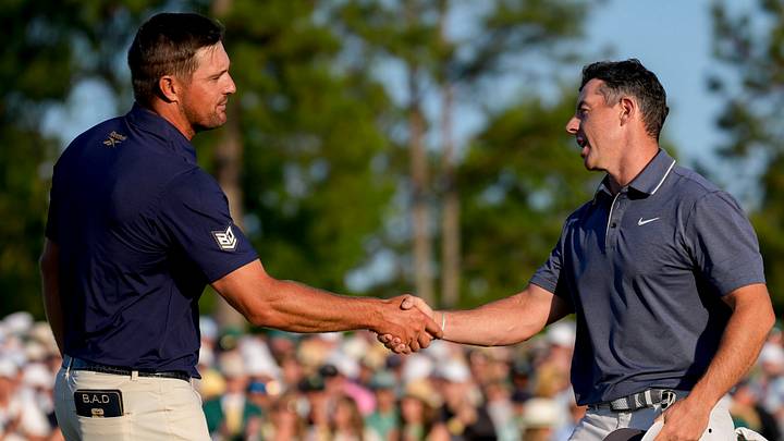 Bryson DeChambeau and Rory McIlroy shake hands on no. 18 during the final round of the Masters Tournament at Augusta National Golf Club in 2025.