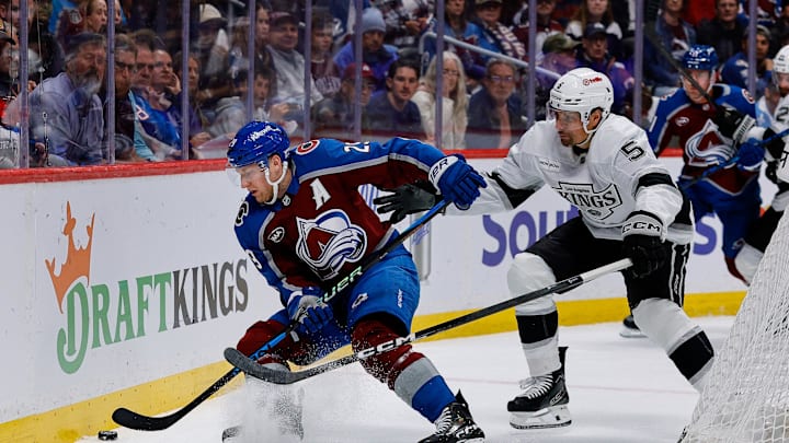 Colorado Avalanche center Nathan MacKinnon (29) and Los Angeles Kings defenseman Cody Ceci (5) 