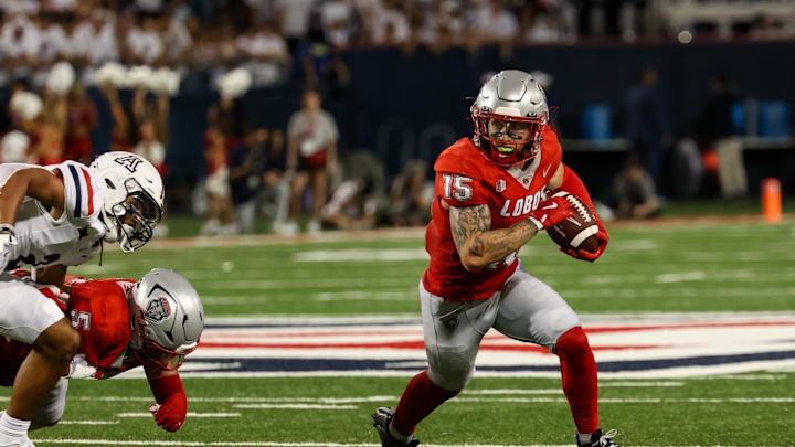 Aug 31, 2024; Tucson, Arizona, USA; New Mexico wide receiver Luke Wysong (15) runs ball during second quarter at Arizona Stadium. Mandatory Credit: Aryanna Frank-Imagn Images