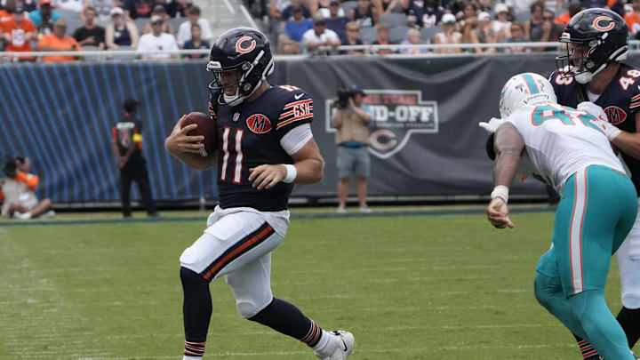 Aug 10, 2025; Chicago, Illinois, USA; Chicago Bears quarterback Case Keenum (11) runs the ball against the Miami Dolphins during the second half at Soldier Field. Mandatory Credit: David Banks-Imagn Images