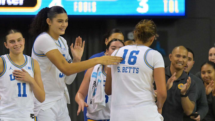 Dec 16, 2025; Los Angeles, California, USA;  UCLA Bruins forward Sienna Betts (16) is congratulated at the bench by center Lauren Betts (51) during the second half at Pauley Pavilion presented by Wescom Financial. Mandatory Credit: Jayne Kamin-Oncea-Imagn Images