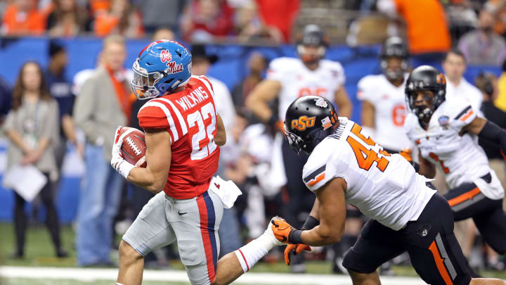 Jan 1, 2016; New Orleans, LA, USA; Mississippi Rebels running back Jordan Wilkins (22) out runs Oklahoma State Cowboys linebacker Chad Whitener (45) for a touchdown in the third quarter of the 2016 Sugar Bowl at the Mercedes-Benz Superdome. Mandatory Credit: Chuck Cook-USA TODAY Sports