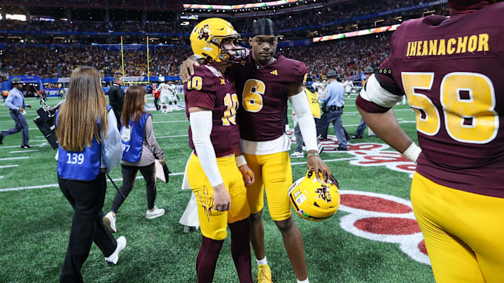 Jan 1, 2025; Atlanta, GA, USA; Arizona State Sun Devils quarterback Sam Leavitt (10) is consoled by quarterback Jeff Sims (6) after a loss against the Texas Longhorns in the Peach Bowl at Mercedes-Benz Stadium. Mandatory Credit: Brett Davis-Imagn Images Jan 1, 2025; Atlanta, GA, USA; Arizona State Sun Devils quarterback Sam Leavitt (10) is consoled by quarterback Jeff Sims (6) after a loss against the Texas Longhorns in the Peach Bowl at Mercedes-Benz Stadium. Mandatory Credit: Brett Davis-Imagn Images