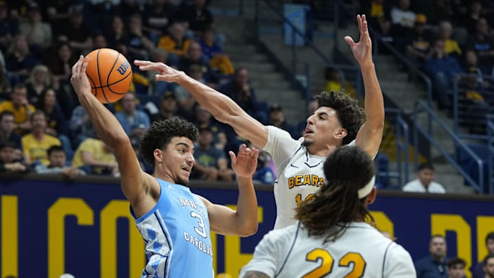 Jan 17, 2026; Berkeley, California, USA; North Carolina Tar Heels guard Derek Dixon (3) passes against California Golden Bears guard Justin Pippen (right) during the first half at Haas Pavilion. Mandatory Credit: Darren Yamashita-Imagn Images
