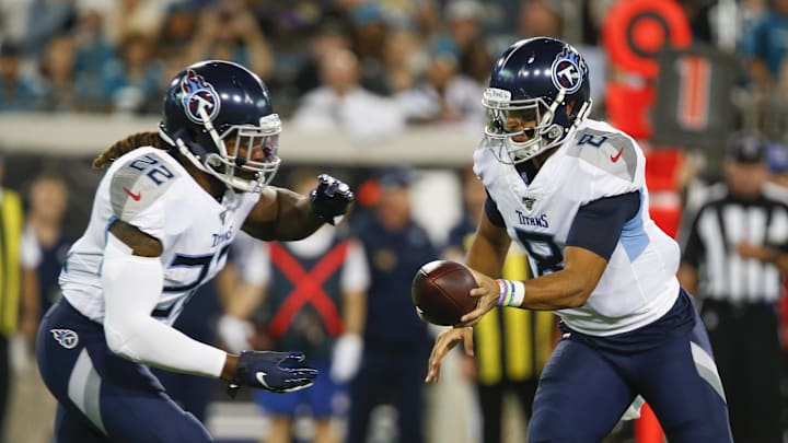 Sep 19, 2019; Jacksonville, FL, USA; Tennessee Titans quarterback Marcus Mariota (8) hands the ball off to running back Derrick Henry (22) during the first quarter against the Jacksonville Jaguars at TIAA Bank Field. Mandatory Credit: Reinhold Matay-Imagn Images