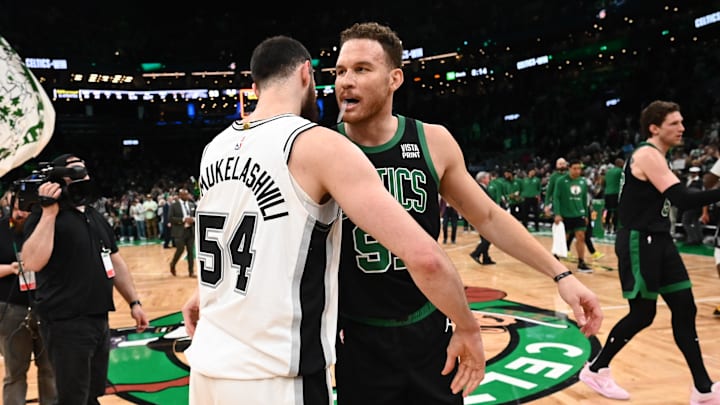 Mar 26, 2023; Boston, Massachusetts, USA; Boston Celtics forward Blake Griffin (91) hugs San Antonio Spurs forward Sandro Mamukelashvili (54) after a game at the TD Garden. Mandatory Credit: Brian Fluharty-Imagn Images