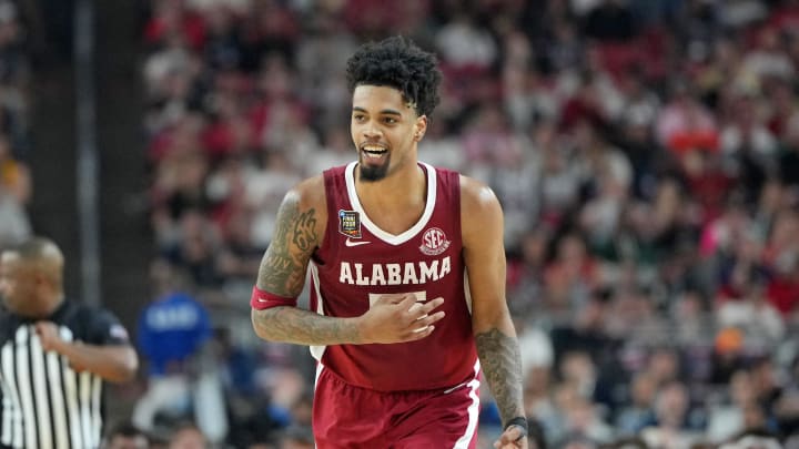 Apr 6, 2024; Glendale, AZ, USA; Alabama Crimson Tide guard Aaron Estrada (55) reacts after a three