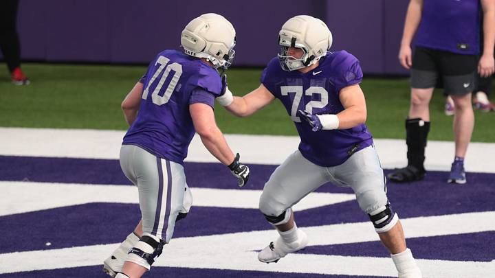 Kansas State sophomore offensive lineman Gus Hawkins (70) works on a drill with sophomore offensive lineman Ryan Howard (72) during practice on Tuesday, April 21, 2026. Kansas State sophomore offensive lineman Gus Hawkins (70) works on a drill with sophomore offensive lineman Ryan Howard (72) during practice on Tuesday, April 21, 2026.