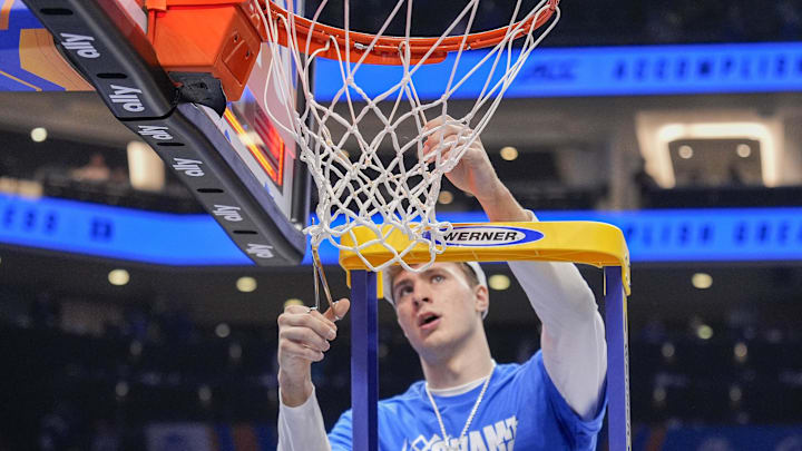Mar 15, 2025; Charlotte, NC, USA; Duke basketball forward Cooper Flagg (2) cuts down part of the net after the win over the Louisville Cardinalsduring the 2025 ACC Conference Championship game at Spectrum Center.