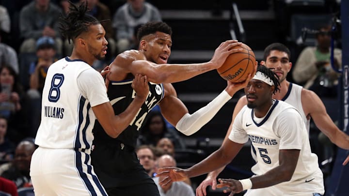 Feb 15, 2024; Memphis, Tennessee, USA; Milwaukee Bucks forward Giannis Antetokounmpo (34) controls the ball as Memphis Grizzlies forward Ziaire Williams (8) and guard Vince Williams Jr. (5) defend during the first half at FedExForum. Mandatory Credit: Petre Thomas-Imagn Images Feb 15, 2024; Memphis, Tennessee, USA; Milwaukee Bucks forward Giannis Antetokounmpo (34) controls the ball as Memphis Grizzlies forward Ziaire Williams (8) and guard Vince Williams Jr. (5) defend during the first half at FedExForum. Mandatory Credit: Petre Thomas-Imagn Images