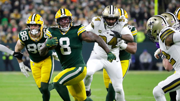 Green Bay Packers running back Josh Jacobs (8) runs for a first down against the New Orleans Saints on Monday night.