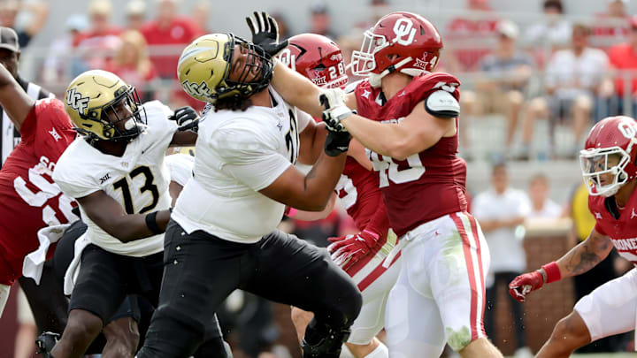 Oklahoma's Ethan Downs (40) blocks against Marcellus Marshall (72) in the first half of the college football game between the University of Oklahoma Sooners and the University of Central Florida Knights at Gaylord Family Oklahoma-Memorial Stadium in Norman, Okla., Saturday, Oct., 21, 2023.