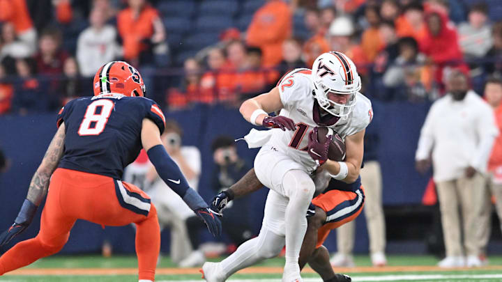 Nov 2, 2024; Syracuse, New York, USA; Virginia Tech Hokies wide receiver Stephen Gosnell (12) runs by Syracuse Orange defensive back Justin Barron (8) after making a catch in the fourth quarter at JMA Wireless Dome. Mandatory Credit: Mark Konezny-Imagn Images Nov 2, 2024; Syracuse, New York, USA; Virginia Tech Hokies wide receiver Stephen Gosnell (12) runs by Syracuse Orange defensive back Justin Barron (8) after making a catch in the fourth quarter at JMA Wireless Dome. Mandatory Credit: Mark Konezny-Imagn Images