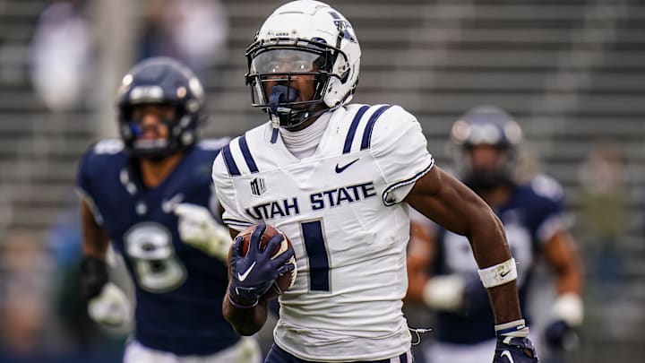 Sep 30, 2023; East Hartford, Connecticut, USA; Utah State Aggies wide receiver Jalen Royals (1) runs the ball for a touchdown against the UConn Huskies in the second half at Rentschler Field at Pratt & Whitney Stadium. Mandatory Credit: David Butler II-Imagn Images