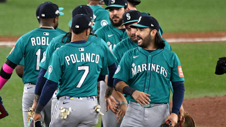 Oct 12, 2025; Toronto, Ontario, CAN; Seattle Mariners second baseman Jorge Polanco (7) and third baseman Eugenio Suarez (28) celebrate with teammates after defeating the Toronto Blue Jays in game one of the ALCS round for the 2025 MLB playoffs at Rogers Centre. Mandatory Credit: Dan Hamilton-Imagn Images