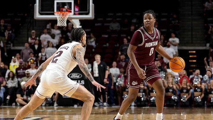 Nov 18, 2025; College Station, Texas, USA; Montana Grizzlies guard Money Williams (0) dribbles the ball during the second half against the Texas A&M Aggies at Reed Arena. Mandatory Credit: Maria Lysaker-Imagn Images