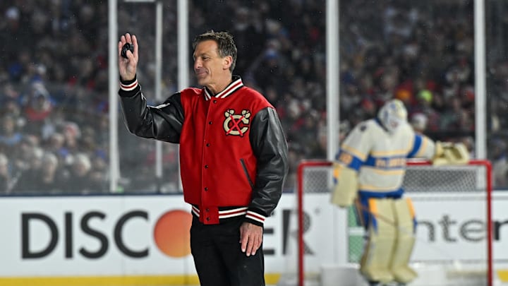Dec 31, 2024; Chicago, Illinois, USA; Chris Chelios, former player for the Chicago Blackhawks, participates in the ceremonial puck drop before the Winter Classic against the St. Louis Blues at Wrigley Field. Mandatory Credit: Daniel Bartel-Imagn Images