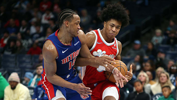 Nov 27, 2024; Memphis, Tennessee, USA; Memphis Grizzlies forward Jaylen Wells (0) drives to the basket as Detroit Pistons guard Wendell Moore Jr. (14) defends during the fourth quarter at FedExForum. Mandatory Credit: Petre Thomas-Imagn Images