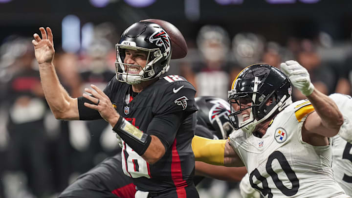 Sep 8, 2024; Atlanta, Georgia, USA; Pittsburgh Steelers linebacker T.J. Watt (90) strips the ball from Atlanta Falcons quarterback Kirk Cousins (18) at Mercedes-Benz Stadium. Mandatory Credit: Dale Zanine-Imagn Images