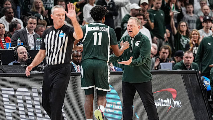 Michigan State head coach Tom Izzo shakes hands with guard Jase Richardson (11) during the first half of the Elite Eight round of NCAA tournament against Auburn at State Farm Arena in Atlanta, Ga. on Sunday, March 30, 2025. Michigan State head coach Tom Izzo shakes hands with guard Jase Richardson (11) during the first half of the Elite Eight round of NCAA tournament against Auburn at State Farm Arena in Atlanta, Ga. on Sunday, March 30, 2025.