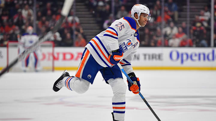 Apr 7, 2025; Anaheim, California, USA; Edmonton Oilers defenseman Darnell Nurse (25) shoots against the Anaheim Ducks during the first period at Honda Center. Mandatory Credit: Gary A. Vasquez-Imagn Images