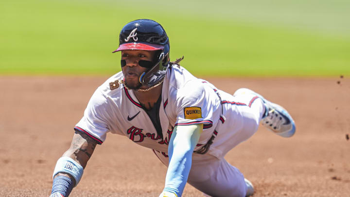 Atlanta Braves right fielder Ronald Acuna Jr (13) slides into third base against the San Diego Padres during the first inning at Truist Park in 2024. Atlanta Braves right fielder Ronald Acuna Jr (13) slides into third base against the San Diego Padres during the first inning at Truist Park in 2024.