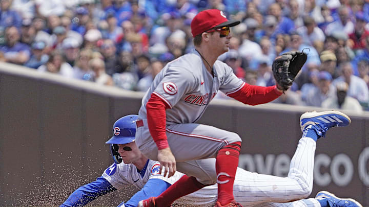 Jun 1, 2025; Chicago, Illinois, USA; Chicago Cubs outfielder Pete Crow-Armstrong (4) steals second base as Cincinnati Reds second base Matt McLain (9) takes a late throw during the first inning at Wrigley Field. Mandatory Credit: David Banks-Imagn Images