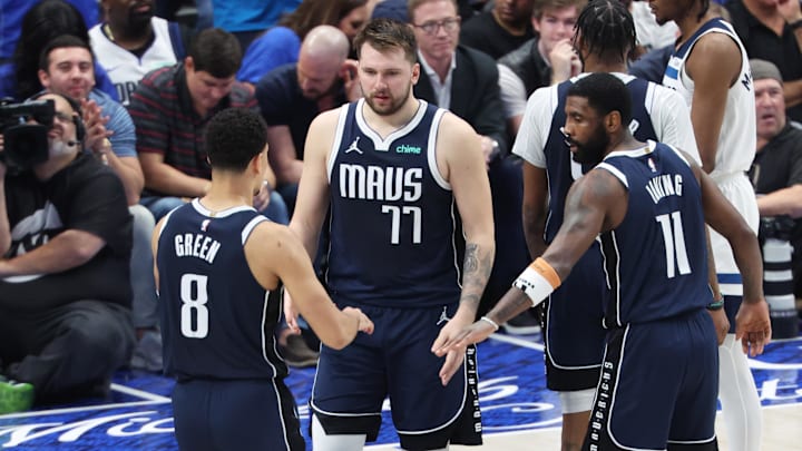 May 26, 2024; Dallas, Texas, USA; Dallas Mavericks guard Luka Doncic (77) and guard Josh Green (8) and guard Kyrie Irving (11) react in the second half against the Minnesota Timberwolves during game three of the Western Conference finals for the 2024 NBA playoffs at American Airlines Center. Mandatory Credit: Kevin Jairaj-Imagn Images