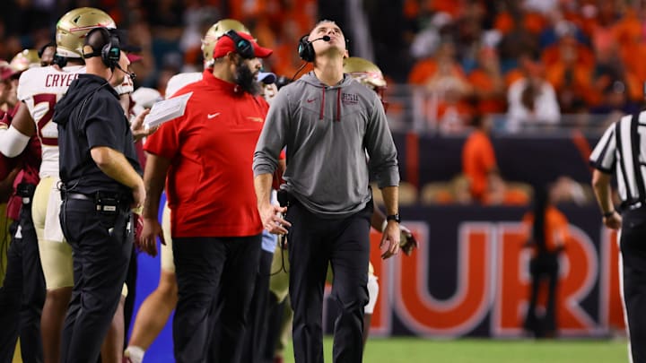 Oct 26, 2024; Miami Gardens, Florida, USA; Florida State Seminoles head coach Mike Norvell reacts from the sideline against the Miami Hurricanes during the fourth quarter at Hard Rock Stadium. Mandatory Credit: Sam Navarro-Imagn Images Oct 26, 2024; Miami Gardens, Florida, USA; Florida State Seminoles head coach Mike Norvell reacts from the sideline against the Miami Hurricanes during the fourth quarter at Hard Rock Stadium. Mandatory Credit: Sam Navarro-Imagn Images