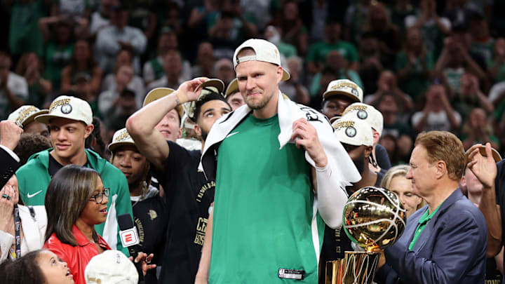 Jun 17, 2024; Boston, Massachusetts, USA; Boston Celtics center Kristaps Porzingis (8) celebrates after winning the 2024 NBA Finals against the Dallas Mavericks at TD Garden. Mandatory Credit: Peter Casey-Imagn Images Jun 17, 2024; Boston, Massachusetts, USA; Boston Celtics center Kristaps Porzingis (8) celebrates after winning the 2024 NBA Finals against the Dallas Mavericks at TD Garden. Mandatory Credit: Peter Casey-Imagn Images