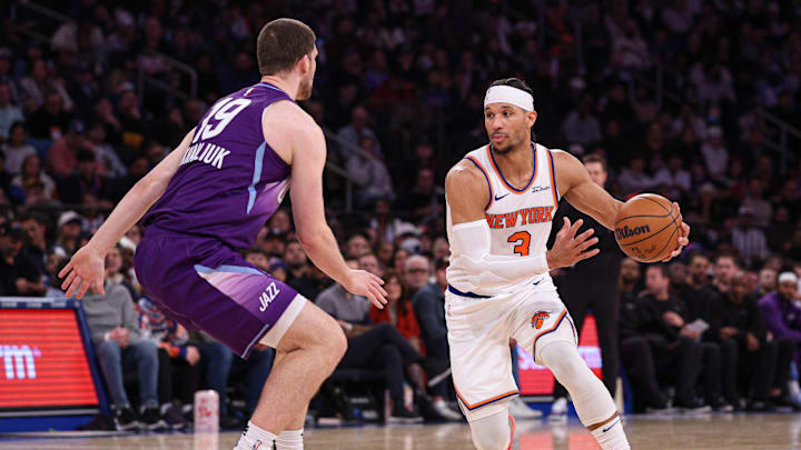 Jan 1, 2025; New York, New York, USA; New York Knicks guard Josh Hart (3) dribbles in front of Utah Jazz guard Svi Mykhailiuk (19) during the second half at Madison Square Garden. Mandatory Credit: Vincent Carchietta-Imagn Images