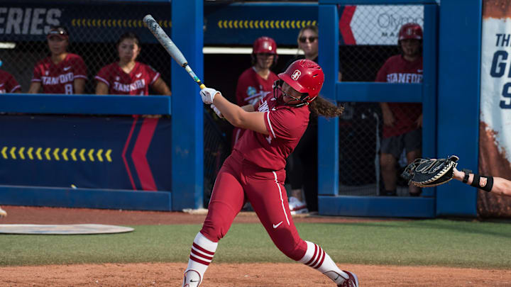 May 30, 2024; Oklahoma City, OK, USA; Stanford Cardinals outfielder Caelan Koch (3) hits fly ball for an out in the second inning against the Texas Longhorns during a Women's College World Series softball game at Devon Park. Mandatory Credit: Brett Rojo-Imagn Images