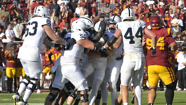 Penn State kicker Ryan Barker (94) is congratulated after hitting the winning field goal in overtime to defeat the USC Trojans at the Los Angeles Memorial Coliseum. Penn State kicker Ryan Barker (94) is congratulated after hitting the winning field goal in overtime to defeat the USC Trojans at the Los Angeles Memorial Coliseum.